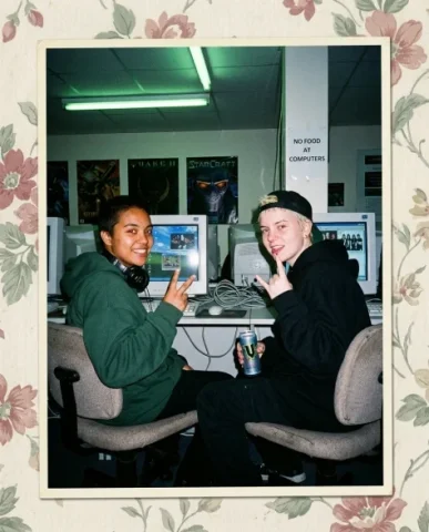 Nostalgic Flash — Late 90s Internet Café 3 — Nano Banana AI Prompt: Close-up shot of the desk area at an internet café showing two pairs of hands ga...