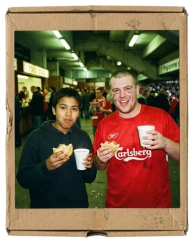 Stadium — Champions League Night, 2005 4 — Nano Banana AI Prompt: Wide shot from the stadium stand during the Champions League night match — the p...