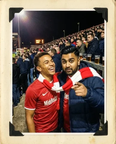 Stadium — Local Derby, Friday Night, 2012 1 — Nano Banana AI Prompt: The young person with short dark hair and warm brown skin standing on a metal cr...