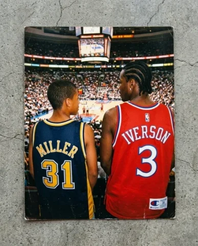 Courtside — NBA Game, 2003 5 — Nano Banana AI Prompt: Close-up from behind of two friends showing off the backs of their oversized NBA...