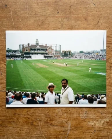 Cricket Ground — Test Match, 2001 5 — Nano Banana AI Prompt: South Asian man with a neat side part wearing a white cricket sweater vest over...