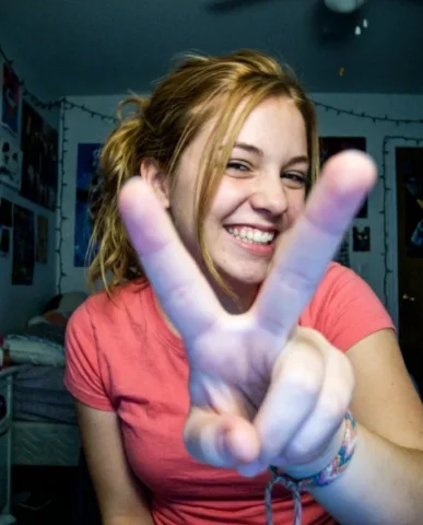 Extreme Lo-Fi Webcam Contact Sheet — 48 Panels 5 — Nano Banana AI Prompt: The young woman with slightly messy honey-blonde hair holds a peace sign extreme...