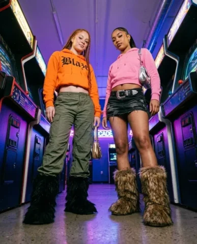 Retro Arcade Duo in Y2K Fashion — Three-Shot Series 4 — Nano Banana AI Prompt: Both have long thick blonde-toned braids draped over their shoulders. They pose...