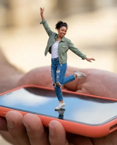 Surreal Miniature Dancing Composite on Smartphone 4 — Nano Banana AI Prompt: An extreme macro close-up of the miniature hyper-realistic figure perched on the...