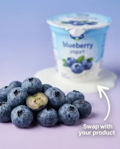 Dynamic Blueberry Yogurt Product Photography 3 — Nano Banana AI Prompt: High-end commercial product photograph from a low upward angle. The blueberry yo...