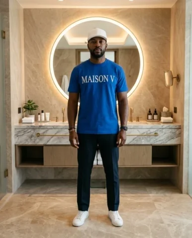 Luxury Bathroom Lifestyle Portrait with Designer Tee 5 — Nano Banana AI Prompt: The image is rendered with shallow depth of field that softly blurs the backgrou...