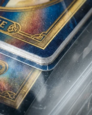 Collectible Card in Transparent Zip Bag Macro Shot 7 — Nano Banana AI Prompt: An extreme macro close-up of one corner of the collectible card as seen through...