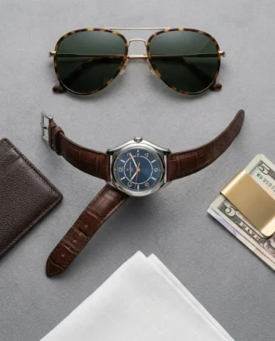 Low-Angle Fashion Campaign with Luxury Watch 6 — Nano Banana AI Prompt: Moderate depth of field keeping the model and watch in focus. Commercial fashion...