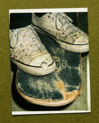 90s Skate Magazine Freeze-Frame Diorama Grid 4 — Nano Banana AI Prompt: The photograph is a close-up detail shot of a skateboard lying on the ramp surfa...