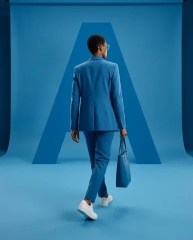 Monochromatic Fashion Studio Editorial 7 — Nano Banana AI Prompt: The subjects wear bold cerulean-blue outfits — either a sharply tailored two-pie...
