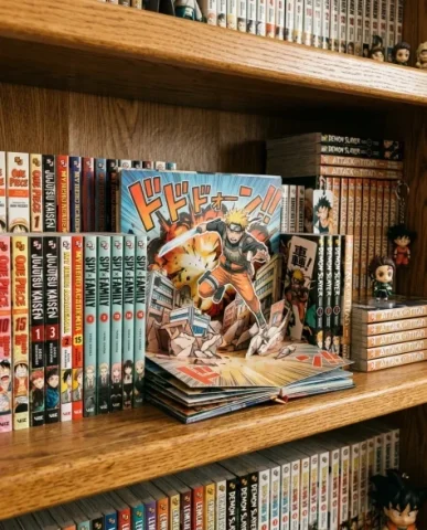 Pop-Up Book Manga Character Diorama 7 — Nano Banana AI Prompt: The manga panel backdrop is visible as a folded paper wall standing vertically f...