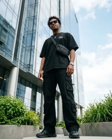 Ultra-Realistic Streetwear Portrait in Urban Setting 7 — Nano Banana AI Prompt: An ultra-realistic portrait of a young man walking away from the camera in a thr...