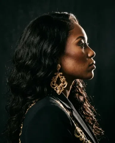 Bold Opulent Gold Statement Earring Dramatic Portrait 2 — Nano Banana AI Prompt: Large commanding gold baroque statement earrings. Bold opulence and attitude. St...