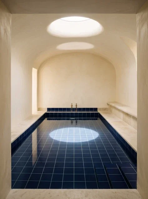 Blue-Tiled Bath Beneath a Skylight