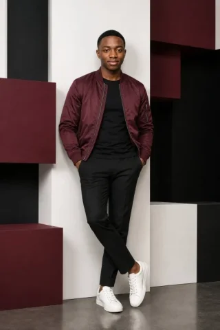Geometric Studio Menswear Portrait — GPT Image 2.5 AI Prompt: Use the uploaded image as the composition, pose, outfit styling, lighting, and g...