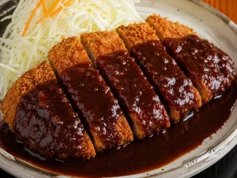E-commerce Main Image - Glossy Tonkatsu Food Photo — GPT Image 2.5 AI Prompt: Create a realistic close-up food photograph of Japanese tonkatsu with dark demi-...