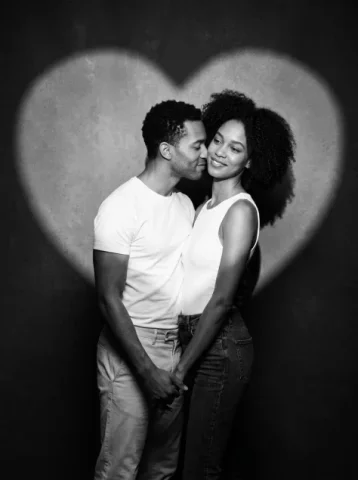 Romantic B&W Studio Couple Portrait — Nano Banana 2 AI Prompt: Create a romantic black-and-white studio portrait of a real skinny couple standi...