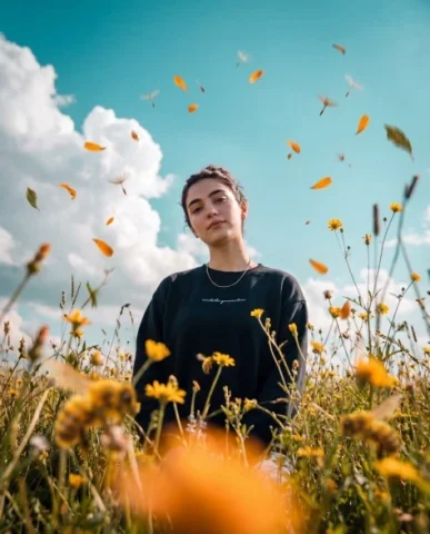 Low-Angle Meadow Sky Portrait — Nano Banana 2 AI Prompt: Photorealistic cinematic photo, 3:4 vertical frame, shooting from a very low poi...