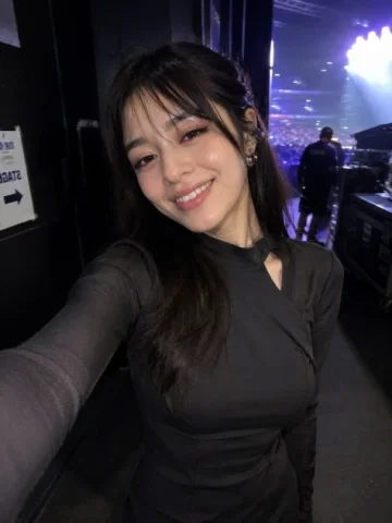 Accidental Backstage iPhone Selfie — Nano Banana 2 AI Prompt: Ultra-realistic accidental iPhone front-camera selfie of the same woman from the...