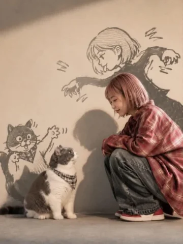 Doodle-Shadow Cat Companion — GPT Image 2.5 AI Prompt: Wholesome anime-inspired lifestyle portrait of a cute young woman with a short p...