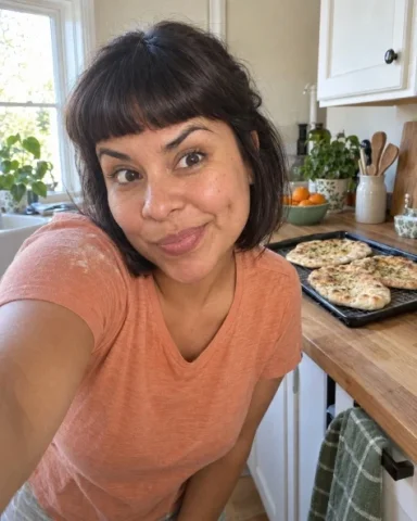 A Playful Selfie While the Flatbreads Cool — Nano Banana 2 AI Prompt: Generate exactly one original image, a single finished photograph with aspect ra...