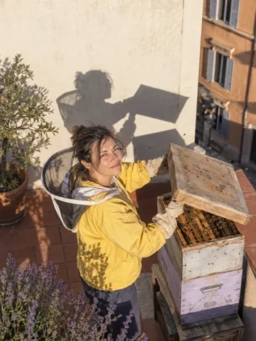Afternoon with the Rooftop Beekeeper — Nano Banana 2 AI Prompt: Generate exactly one original image, a single finished photograph with aspect ra...
