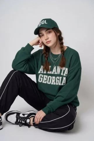 Collegiate Streetwear Studio Seated Portrait — Nano Banana 2 AI Prompt: { "composition": { "framing": "medium full-body portrait", "orientation": "verti...