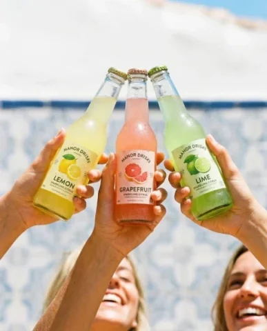 Three-Hand Bottle Beverage Ad Set — Nano Banana 2 AI Prompt: Nano Banana pro on Gemini app. Prompt: Three hands holding colorful glass soda...