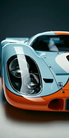 Gulf Livery Racing Car Close-Up — Nano Banana 2 AI Prompt: Ultra-realistic close-up of a vintage Gulf-liveried racing car front, focusing o...
