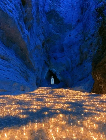 Marian Blue Grotto — Nano Banana 2 AI Prompt: PHOTO A Marian blue grotto cobalt cave walls, a statue of Mary lit from below by...