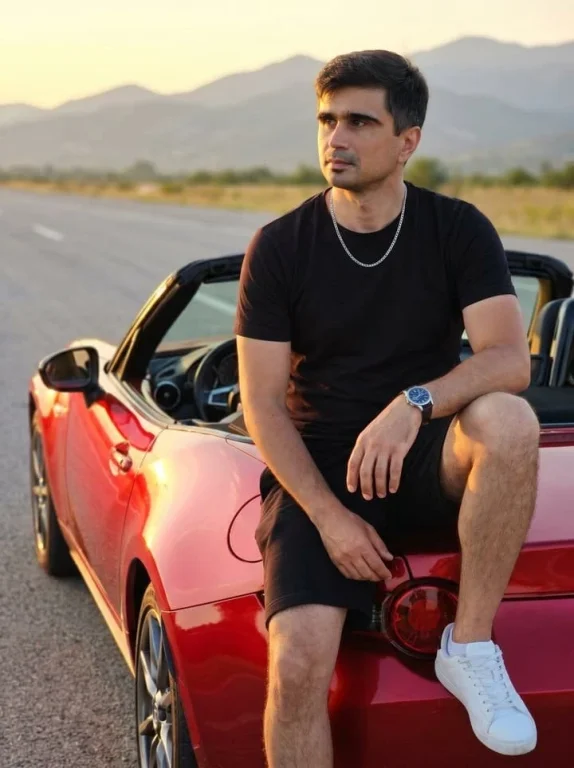 Social Media Post - Man on Red Convertible Sports Car