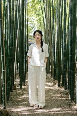 Social Media Post - Suzhou Garden Bamboo Path Portrait — GPT Image 2.5 AI Prompt: Authentic daily life photography, natural candid moment. A full-length portrait...