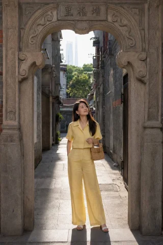 Shikumen Street Portrait — Nano Banana 2 AI Prompt: A candid street photograph of a young woman standing just inside the arched ston...