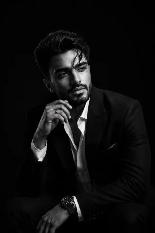 Sophisticated Studio Tuxedo Portrait — Nano Banana 2 AI Prompt: Ultra-realistic black-and-white fine art studio portrait of a handsome young Sou...