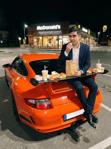 Grit Late Night Parking Lot Fashion — Nano Banana 2 AI Prompt: McDonald’s parking: A gritty handheld iPhone flash photo shot late at night in a...