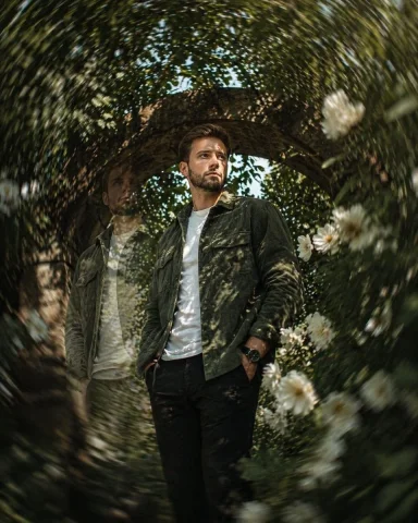 Surreal Garden Portrait — Nano Banana 2 AI Prompt: A cinematic medium-full shot of a man with a short brown beard and brown hair, s...