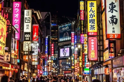 Neon Tokyo Street Scene — Nano Banana 2 AI Prompt: A photorealistic night street photography shot of a bustling Tokyo street, heavi...