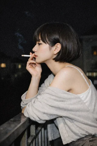 Night Portrait of a Woman — Nano Banana 2 AI Prompt: A photorealistic portrait of a young Asian woman with a short black bob haircut...