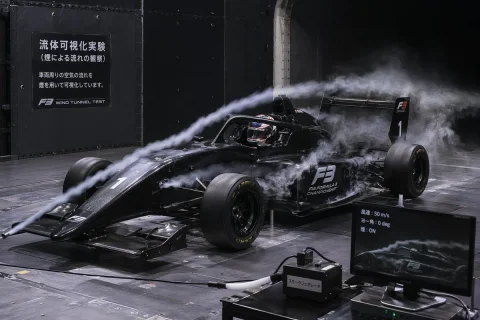 Wind Tunnel Aerodynamics Test — Nano Banana 2 AI Prompt: A photorealistic image of a black Formula 3 race car undergoing an aerodynamic w...