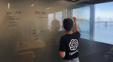 Office Shot — Nano Banana 2 AI Prompt: A wide image shot on iPhone of a glass whiteboard, in a room overlooking the Bay...