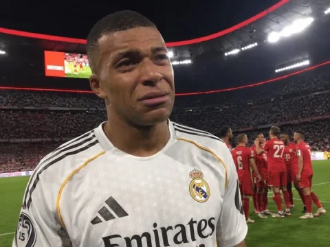 Tearful Pitch Moment — Nano Banana 2 AI Prompt: Amateur iPhone photo of Kylian Mbappé in tears, wearing a Real Madrid jersey on...