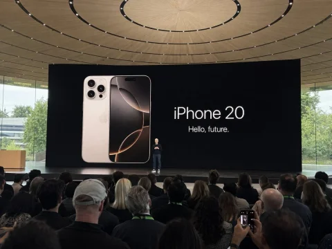 Amateur iPhone Keynote Snapshot — Nano Banana 2 AI Prompt: Amateur iPhone photo at Apple Park during the iPhone 20 keynote, Tim Cook presen...