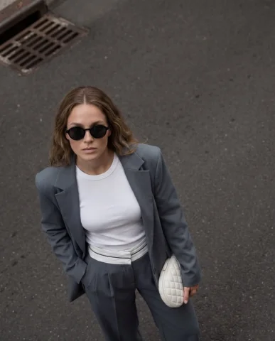 High-Angle Top-Down Street Suit Fashion Portrait — Nano Banana 2 AI Prompt: Cinematic street fashion portrait, high-angle top-down perspective, stylish woma...