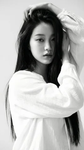 Black White Minimalist Fine Art Portrait Long Hair Female — Nano Banana 2 AI Prompt: Black-and-white portrait of a young woman with long straight dark hair, wearing...