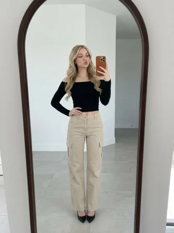 Arched Mirror Selfie Blonde Wavy Hair Cargo Pants Heels Portrait — Nano Banana 2 AI Prompt: Use the same face from the reference image without changing facial features. A y...