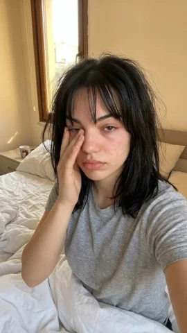 Morning Wake-Up Sleepy Selfie Candid Portrait — Nano Banana 2 AI Prompt: { "scene": "A young woman taking a candid morning selfie in bed, appearing sle...