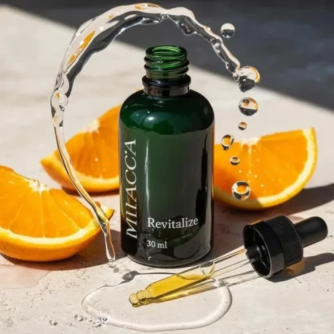 Premium Skincare Serum Orange Macro Product Ad — Nano Banana 2 AI Prompt: Ultra-realistic premium skincare serum bottle (dark green glass with dropper), g...