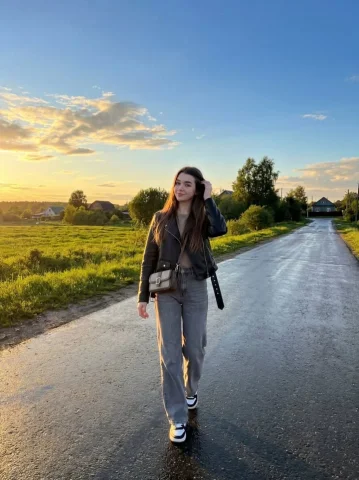 Golden Hour Rural Walk After Rain Portrait — Nano Banana 2 AI Prompt: { "image_generation": { "subject": { "description": "young woman walking alone o...