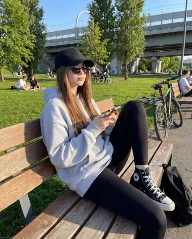 Park Bench Casual Lifestyle Portrait — Nano Banana 2 AI Prompt: { "image_generation": { "subject": { "type": "young woman", "pose": "sitting cas...