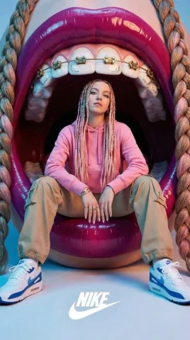 Giant Mouth Editorial Girl — Nano Banana 2 AI Prompt: Close-up stylized editorial photo showing a person seated inside an enormous ope...